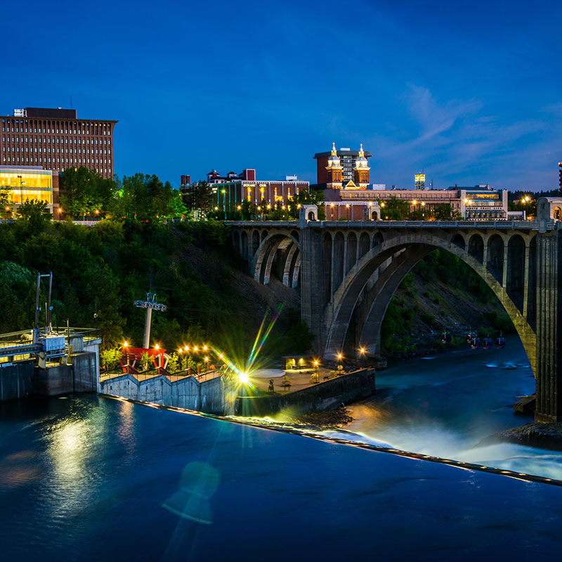 Spokane River Bridge with spokane in the background at night