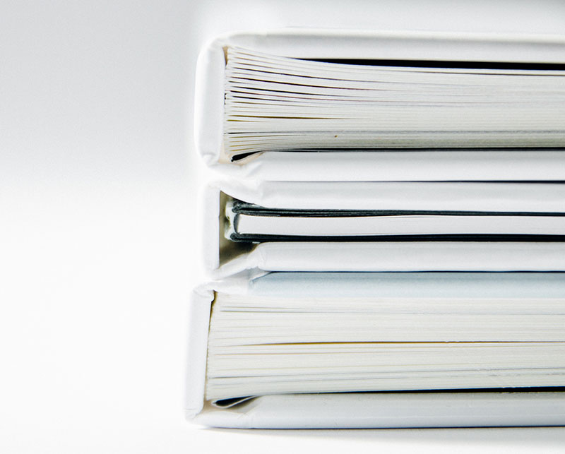 Books stacked on white background